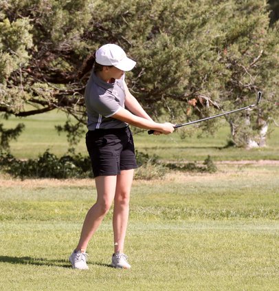 Darby Eakin chips out of the fairway..jpg