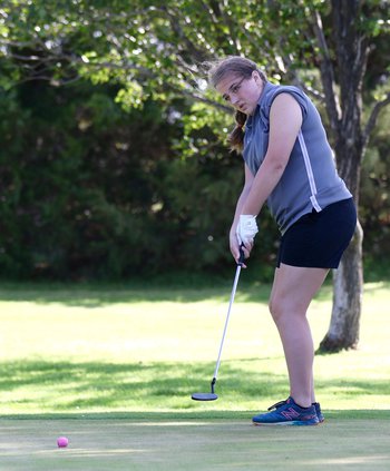 Faith Thompson watches her ball into the hole..jpg