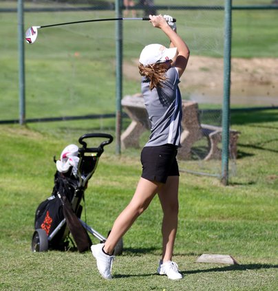 Halle Barker finishes her swing..jpg