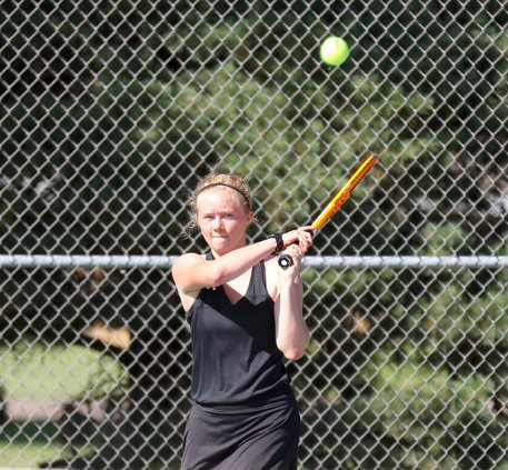 Kristin Anderson returns a backhand winner.jpg
