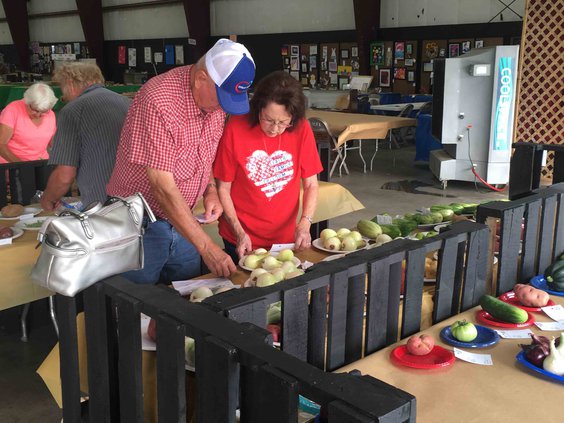Couple checks in produce.jpg